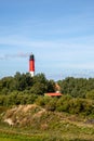 Pellworm Lighthouse behind trees Royalty Free Stock Photo