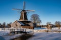 Pelmolen Ter Horst, Rijssen covered in snowy landscape in Overijssel Netherlands, historical wind mill during winter Royalty Free Stock Photo