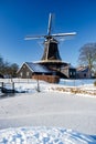 Pelmolen Ter Horst, Rijssen covered in snowy landscape in Overijssel Netherlands, historical wind mill during winter Royalty Free Stock Photo