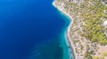 Peloponnese, Greece Aerial view on turqouise blue water and sandy beach. Limni Vouliagmeni or Ireon Lake,