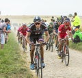 The Peloton on a Cobblestone Road - Tour de France 2015