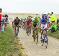 The Peloton on a Cobblestone Road - Tour de France 2015