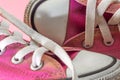 Pemale Pink canvas vintage styled, dirty and gold painted basketball shoes Royalty Free Stock Photo