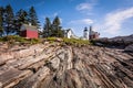 Pemaquid Point Lighthouse atop dramatic rocky coast