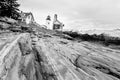 Pemaquid Point Lighthouse, Maine. View of Lighthouse and keeper\'s house from the bottom of rocky cliff. Royalty Free Stock Photo