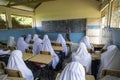 PEMBA ISLAND, ZANZIBAR, TANZANIA - JANUARY 2020: Teacher is Tutor a Lesson for School girls and School Boys in the Royalty Free Stock Photo