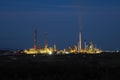 Pembroke oil refinery at night, across from Milford Haven, Pembrokeshire, Wales