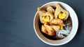 Pempek with vermicelli and cuko sauce on white bowl