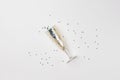 a pen with blue sparkles on a white background