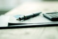 Pen, cellphone and business documentation Royalty Free Stock Photo