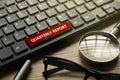 Pen,glasses, magnifying glass and computer key written with QUARTERLY REPORT Royalty Free Stock Photo