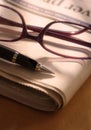 Pen and Glasses on Newspaper Royalty Free Stock Photo