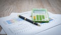 Pen graphs and calculators placed on the table. Concepts Data documents Graphs Graphs Marketing reports Research Development