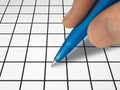 Pen in hand and crossword Royalty Free Stock Photo