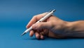 Is on the pen and hand highlighting the simplicity and functionality Royalty Free Stock Photo