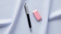 The pen has silver trim and a metallic tip while the eraser features white Royalty Free Stock Photo