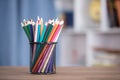 Pen holder filled with colored pencils