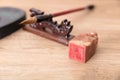 On the pen holder is a writing brush, a seal and inkstone beside it Royalty Free Stock Photo