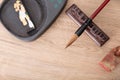 On the pen holder is a writing brush, a seal and inkstone beside it Royalty Free Stock Photo