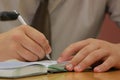 Pen in a man's hand, close up. The man signs the contract. Royalty Free Stock Photo