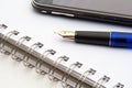 Pen, notebook and cell phone Royalty Free Stock Photo