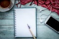 Pen on notebook,cellphone, earphone and coffee Royalty Free Stock Photo