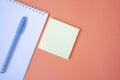Pen and notebook on orange background Royalty Free Stock Photo
