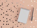 Pen and notebook with scattered stars and circles on a pleasent background . 3D rendering