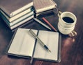 Pen, open notebook, coffee cup Royalty Free Stock Photo