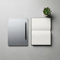 With pen open notebook and small potted succulent on a light gray Royalty Free Stock Photo