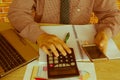 Pen on paperwork accounts with man use computer to save data in background. accounting concept. Man hand with pen, calculator and Royalty Free Stock Photo