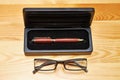 Pen, pen holster and glasses Royalty Free Stock Photo