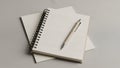 Pen is placed diagonally on the notebook. The background is a Royalty Free Stock Photo