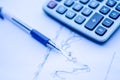 Pen placed over financial statistics and charts Royalty Free Stock Photo