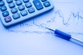 Pen placed over financial statistics and charts Royalty Free Stock Photo
