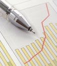 Pen on Positive Earning Graph Royalty Free Stock Photo