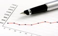 Pen on Positive Earning Graph Royalty Free Stock Photo