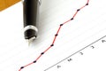 Pen on Positive Earning Graph Royalty Free Stock Photo