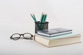 Pen, reading glasses, book and notebook on white background Royalty Free Stock Photo