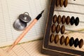 Pen, stamp and old abacus Royalty Free Stock Photo