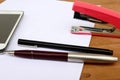 Pen and stapler