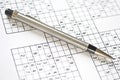 Pen on a sudoku grid. Royalty Free Stock Photo