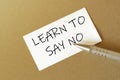 Pen, white paper with text Learn To Say No on the brown background Royalty Free Stock Photo