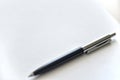 Pen on a white sheet of paper on the table Royalty Free Stock Photo