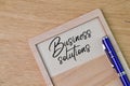 Wooden board written with text BUSINESS SOLUTIONS Royalty Free Stock Photo