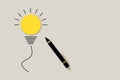 Pen with yellow lightbulb. Ideas inspiration concepts of business finance or goal to success, Creativity of human. Royalty Free Stock Photo