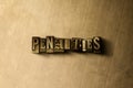 PENALTIES - close-up of grungy vintage typeset word on metal backdrop