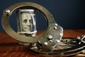 Penalty or bail bond. Money and handcuffs