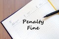 Penalty fine write on notebook Royalty Free Stock Photo