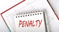 PENALTY text on the notebook on the diary,business concept